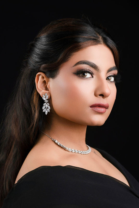 Women dressed in black dress wearing jewelry set