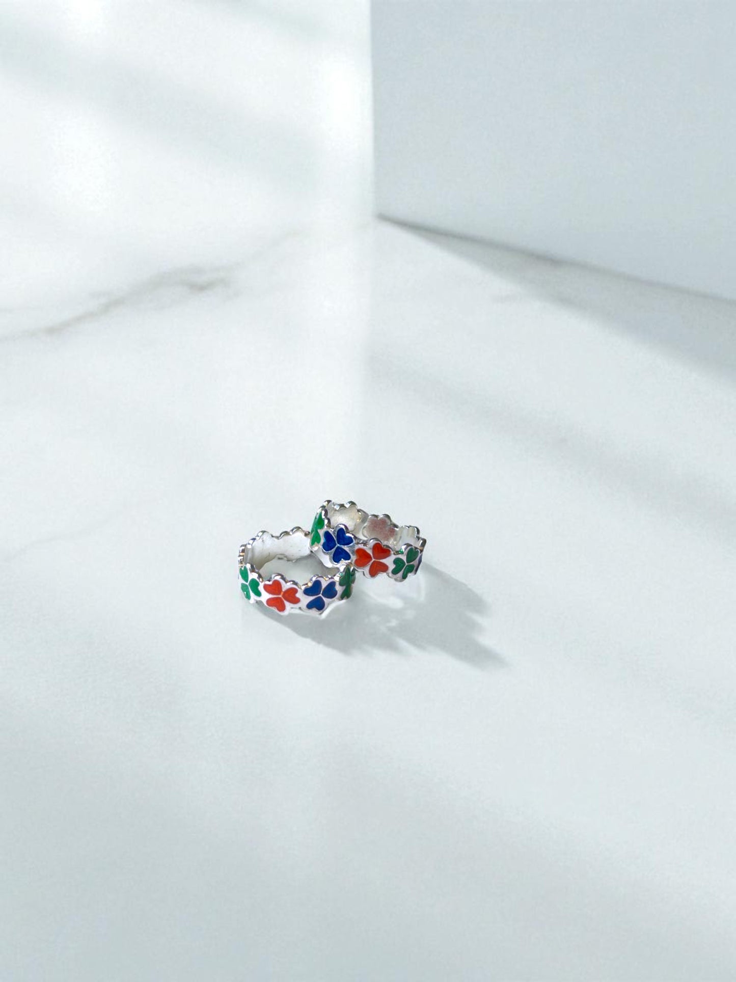 Colorful floral toe ring on a white background