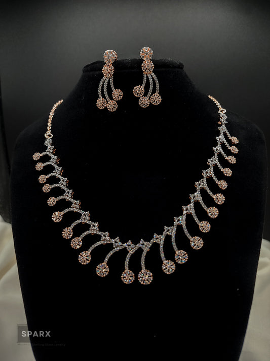 Floral Jewelry Set on a necklace stand with a black background