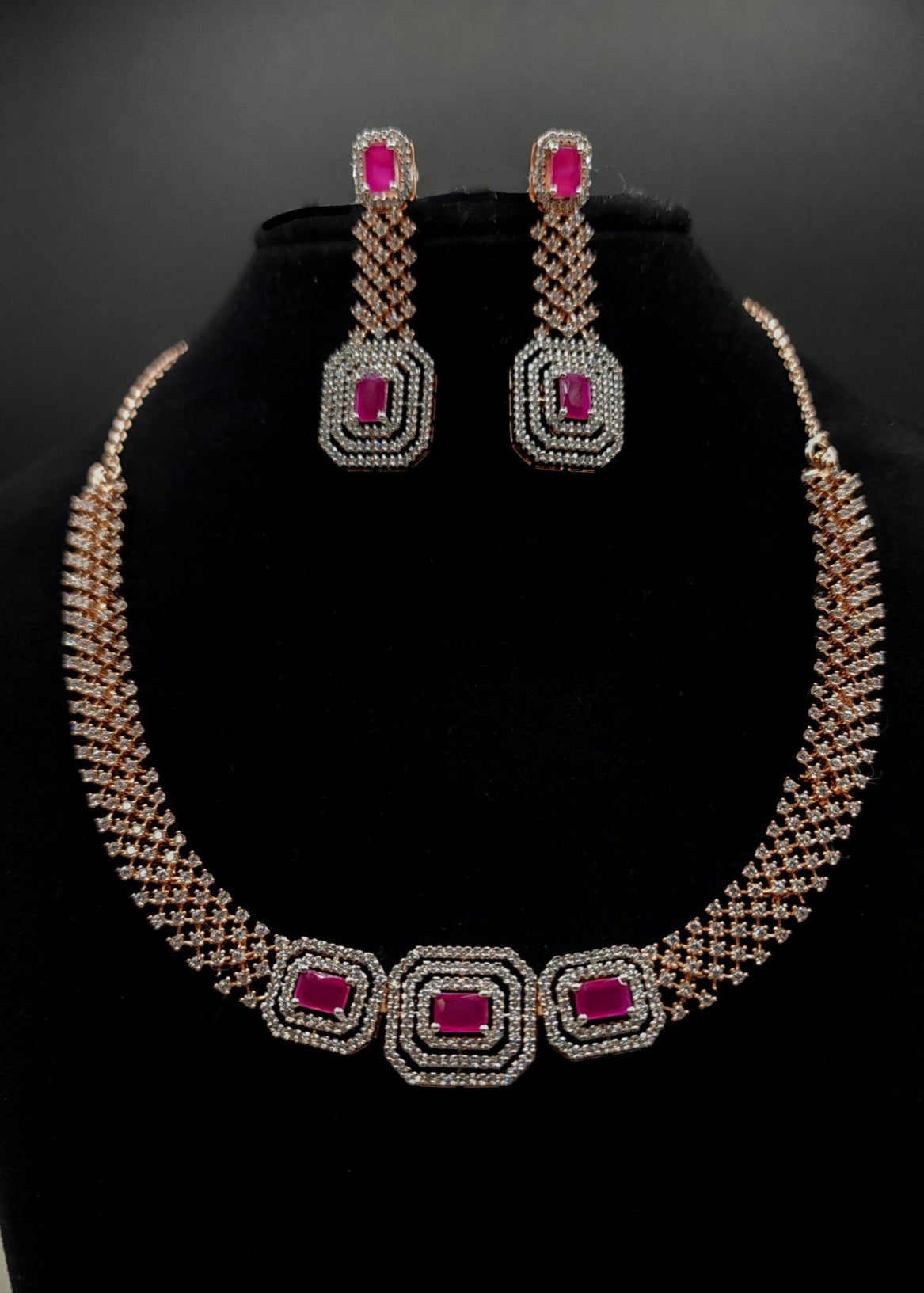 Jewelry set with necklace and earrings on a black stand, featuring SPARX4U branding.