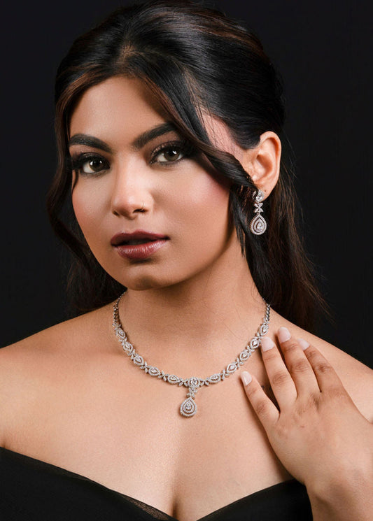 Women dressed in black gown wearing bridal jewelry set