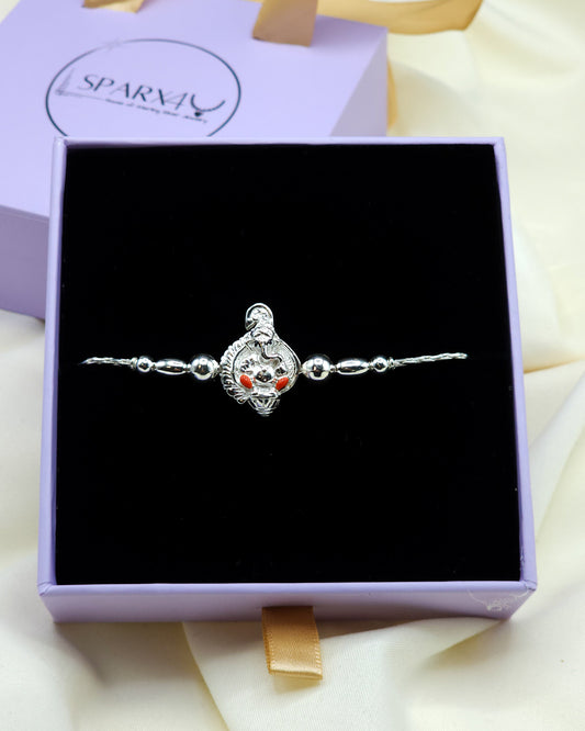 Silver bracelet with a Ganesha charm in a purple box
