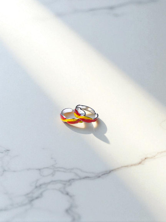 Colorful toe ring on a marble surface