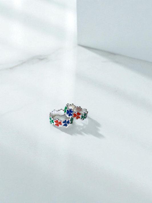 Colorful floral toe ring on a white background