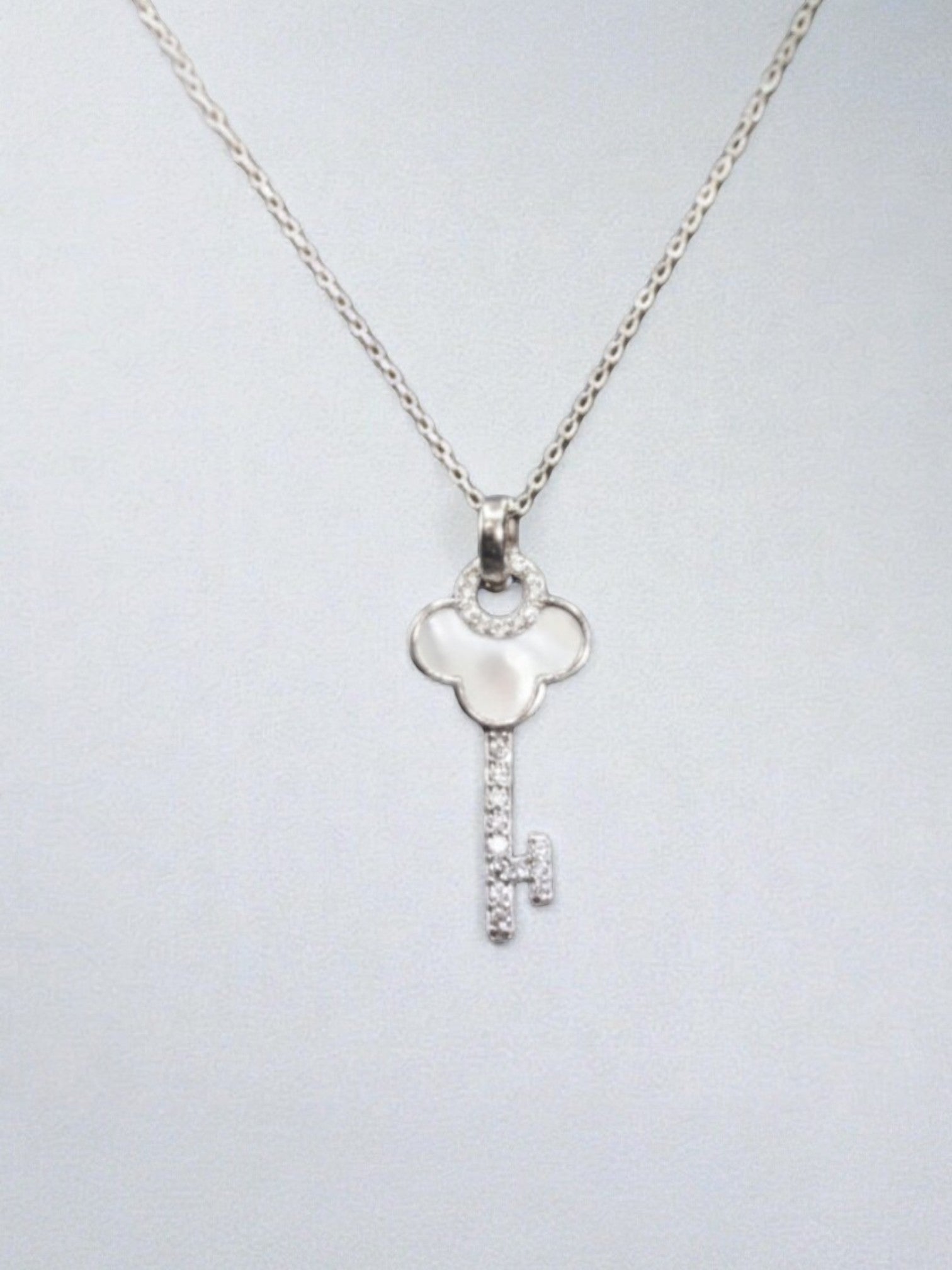 SPARX4U Mother of pearl key necklace with sterling silver chain and pave diamond accents.